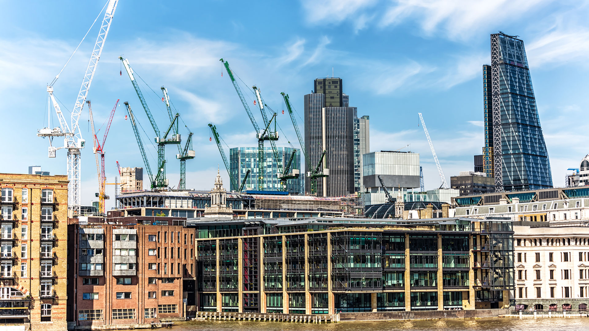The City of London skyscape with cranes